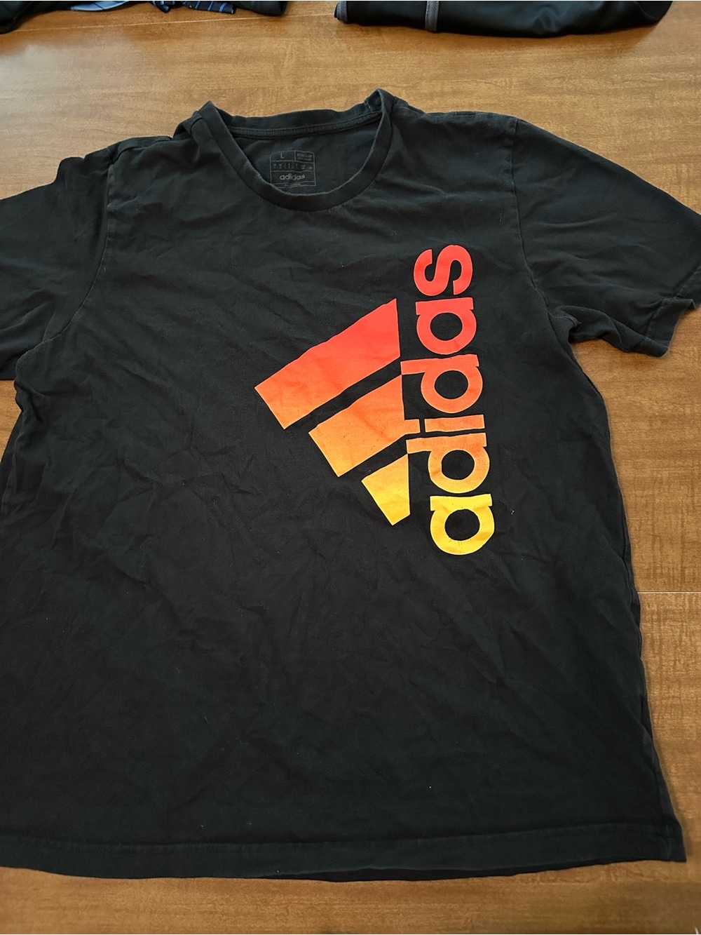 adidas Black Short-Sleeve Tee with Red-Orange-Yellow Gradient Logo